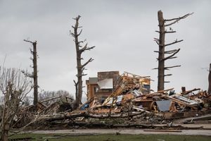 A house and trees destroyed by tornadoes in a March 2026 storm.