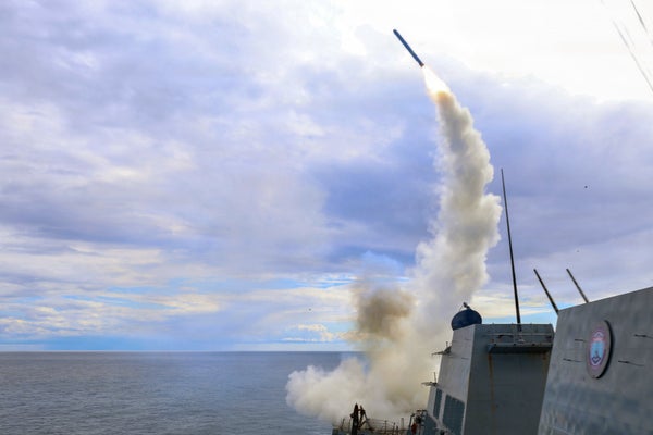 Photo of a Tomahawk missile being launched from a carrier in the ocean