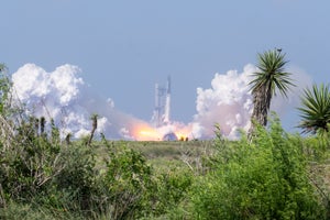 A spaceship launch surrounded by greenery.