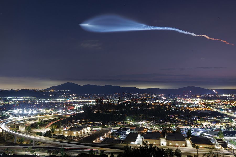 A SpaceX Falcon 9 rocket carrying a payload of 24 Starlink internet satellites soars into space after launching from Vandenberg Space Force Base on July 18, 2025, seen from Santee, California.