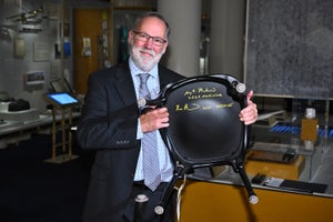 Nobel Prize in Physiology or Medicine laureate and U.S. immunologist Fred Ramsdell poses after signing a chair at the Nobel Prize Museum in Stockholm.