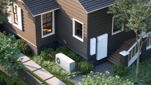 Rendering of a suburban home with wall-mounted electrical panels and a boxy outdoor energy unit beside the landscaping.