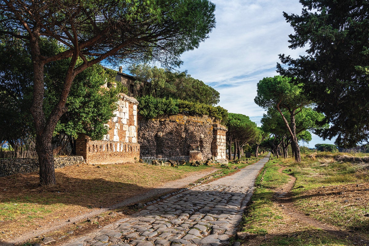 A stretch of the Via Appia showing the straight construction and stone paving associated with classic Roman roads