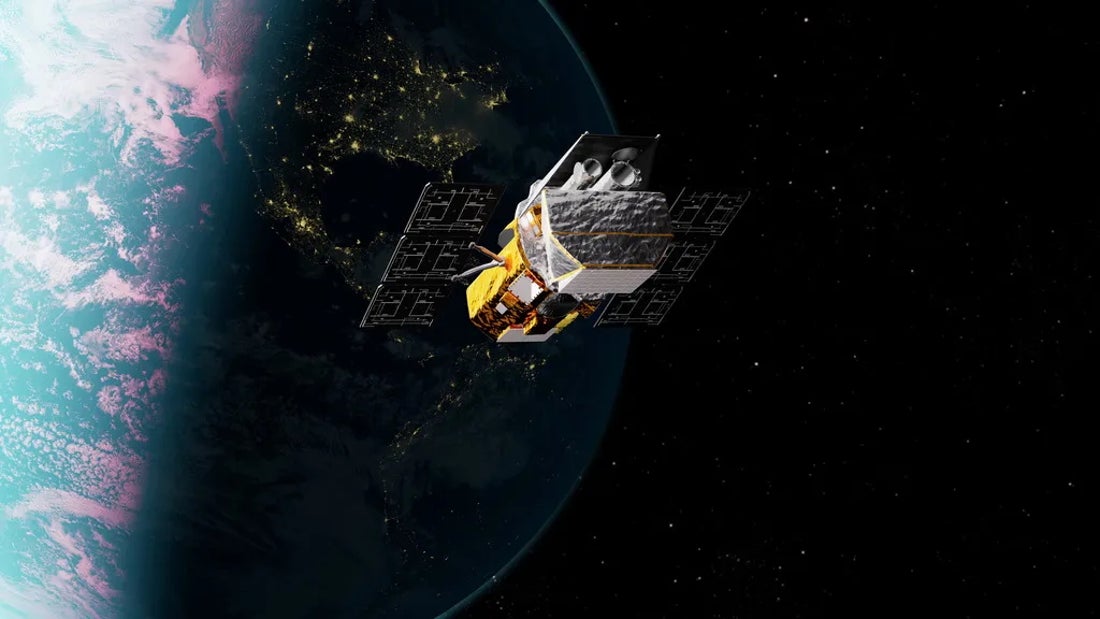 A space telescope soars over the dayside and nightside of Earth.