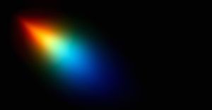 A prismatic blotch of color against a dark background