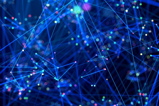 Colorful small dots interconnected by light blue lines across a dark blue background.