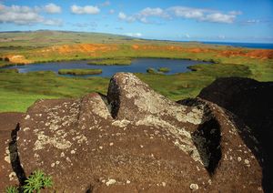 Close up of lying Moai over Rano Raraku Lake, Easter Island, Chile. Image provided by Eric Lafforgue/Getty Images.
