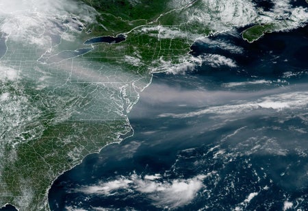 An image of the U.S. East Coast with a swath of gray smoke across it.