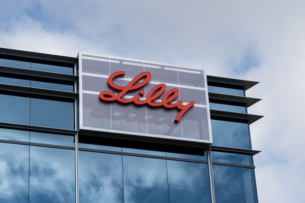 Eli Lilly logo on modern glass office building facade with partly cloudy sky in south San Francisco on October 16, 2025.
