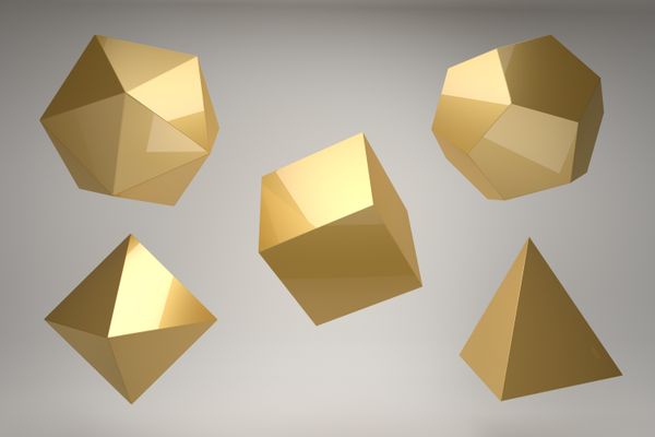 Five golden platonic solids on a gray background.