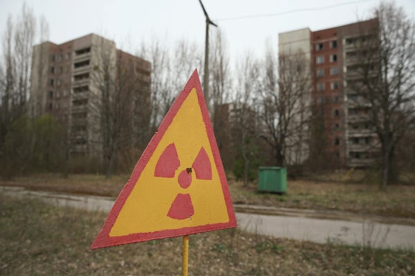 A motion warns of radiation contamination adjacent erstwhile flat buildings connected April 9, 2016 successful Pripyat, Ukraine.