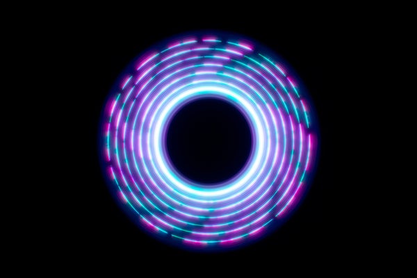 An abstract circle shape spins a light trail on a black background.