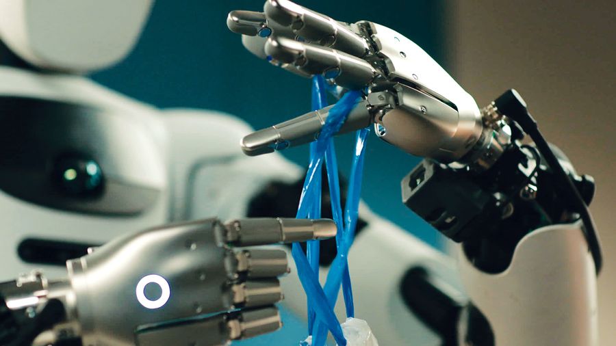 Two robotic hands pull and loop thin blue plastic strips during a knot-tying task.