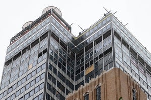 A Manhattan skyscraper under construction and showing signs of damage
