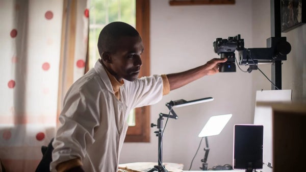 A technician uses specialized high-resolution cameras to digitise specimens at the Royal Botanic Gardens, Kew, in London.