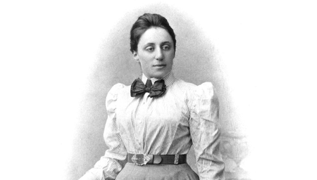 An old print of a photograph of a woman wearing formal clothes