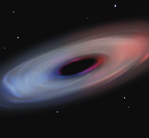 A giant oval cloud of gray gas swirling around a black elliptic center against the backdrop of space. The right side of the cloud is tinged red, and the left is tinged blue.