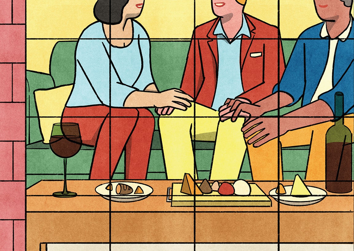 View through a window into a living room. Three people are sitting on a couch in an animated conversation, with hands intertwined