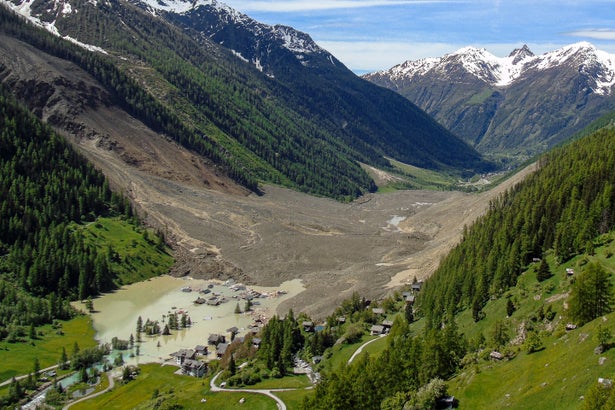 The small village of Blatten in the Swiss Alps is seen buried in debris and flooded by a blocked river after a partial collapse of the Birch Glacier resulted in a landslide