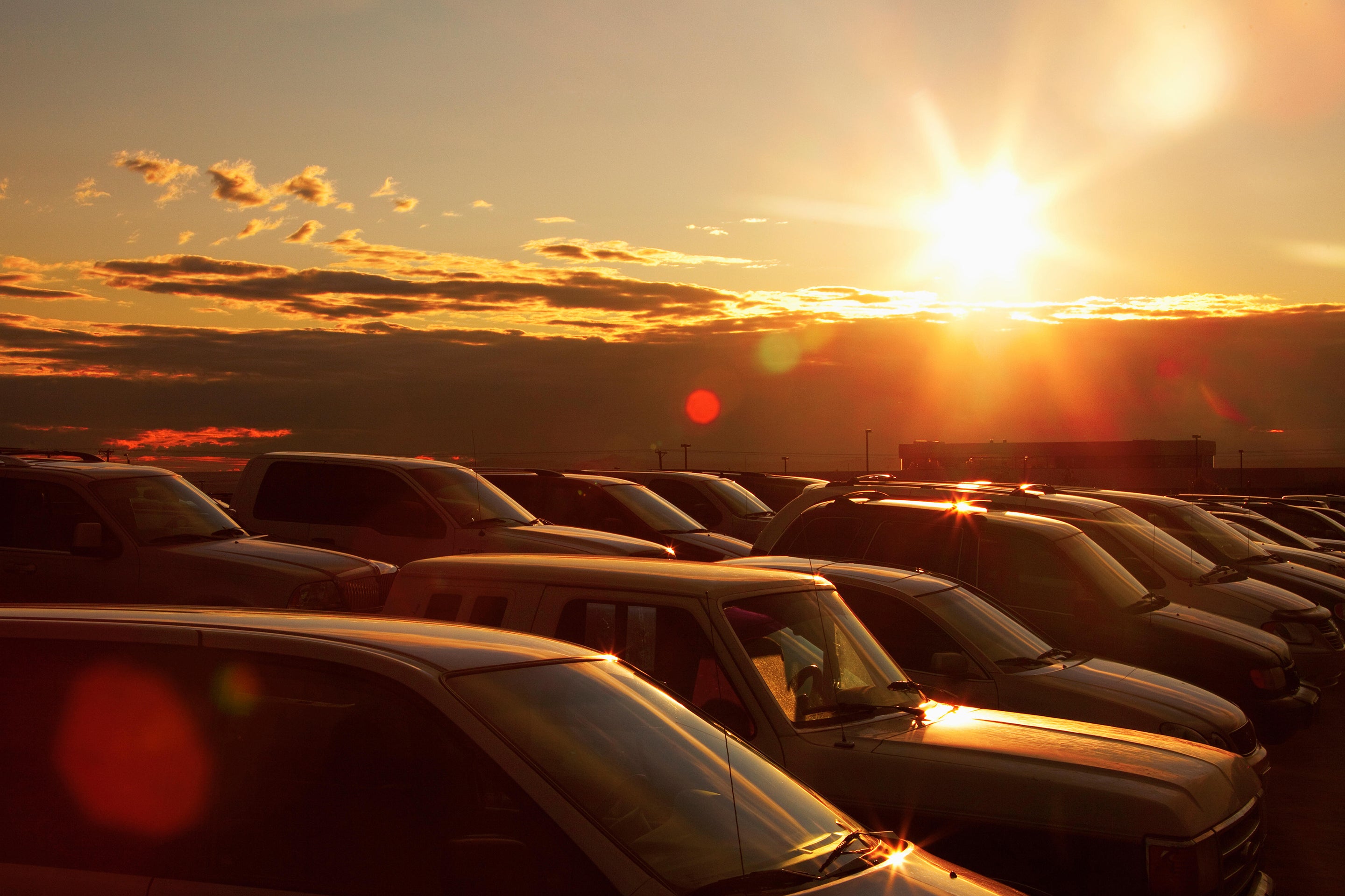 Sunset over parked cars