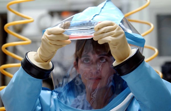 Personnel wearing PPE in bio-level 4 lab
