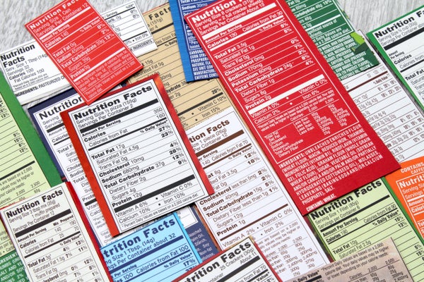 Various nutrition fact labels in red, blue, white and green layed out.