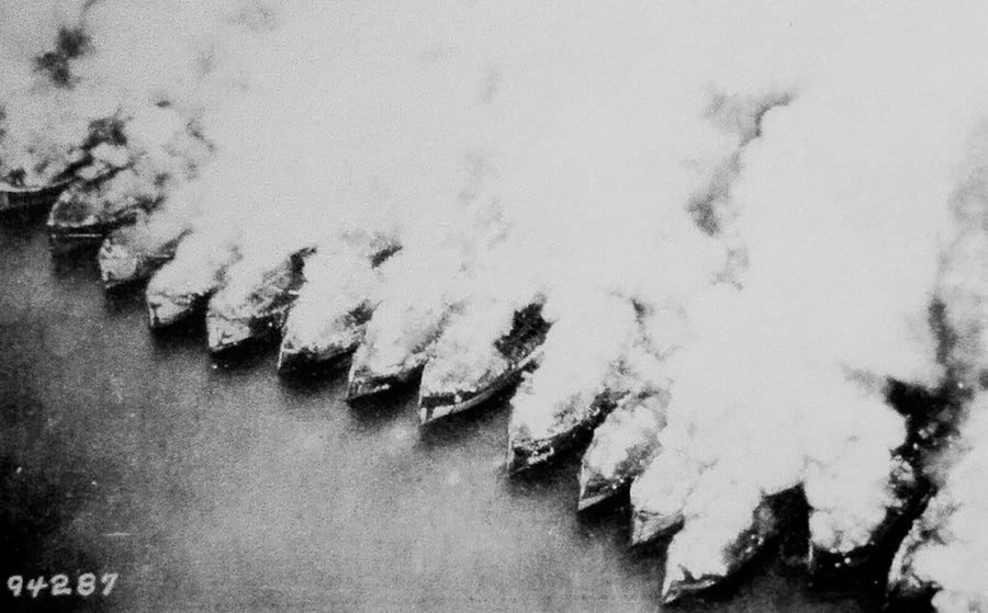 Historic black and white photo showing several US Emergency Fleet vessels on fire at the current site of Mallows Bay-Potomac River National Marine Sanctuary