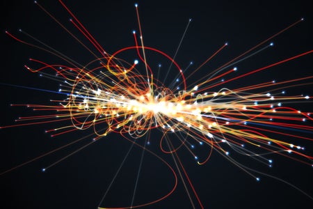 Particles collision in Hadron Collider with red and yellow explosion lines and lights at end and center of swirl.