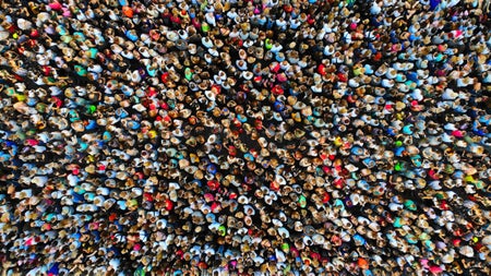 Big crowd of people in a top down view from drone.