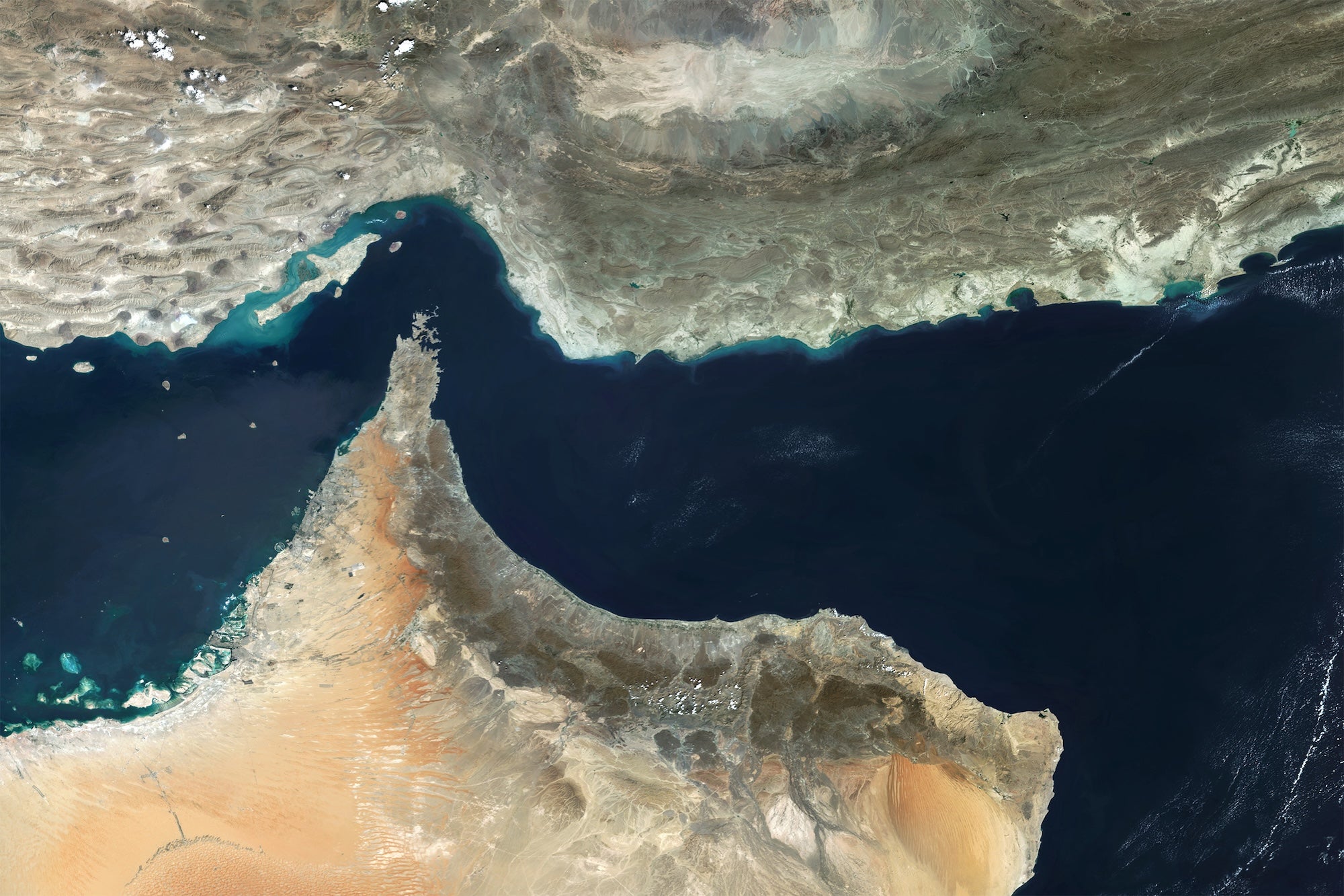 An overhead view of the Strait of Hormuz, with peninsula where Oman is on the bottom and Iran on the top and the Persian Gulf and Gulf of Oman in the middle
