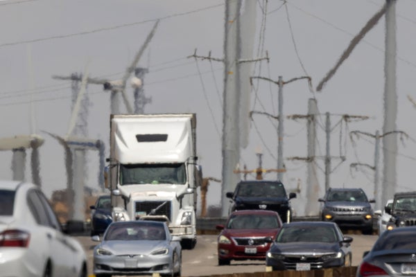 Cars and trucks on the I-10 freeway and electric power lines in the background shimmer in a heat haze as record-breaking heatwaves occur across the nation on July 22, 2023 near Palm Springs, California