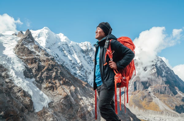 Man with backpack mountains in background