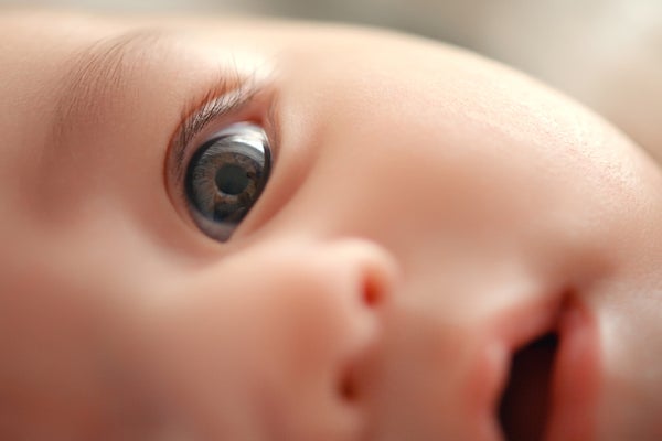 Extreme close up of an infants face with focus on its eye