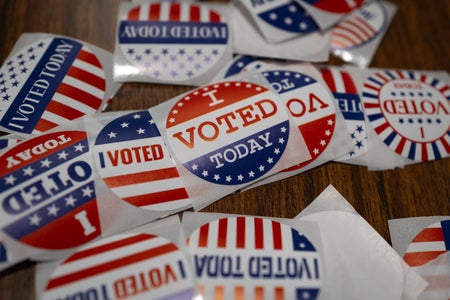 Stickers sit on a table during in-person absentee voting on November 01, 2024 in Little Chute, Wisconsin. Election day is Tuesday November 5. (Photo by Scott Olson/Getty Images)