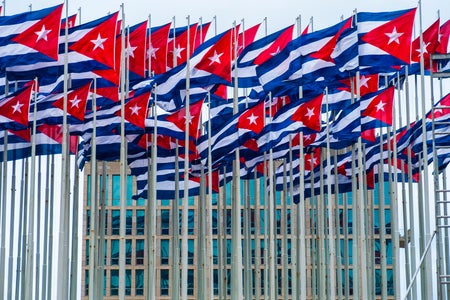 Cuban Flags fly in front of American Embassy
