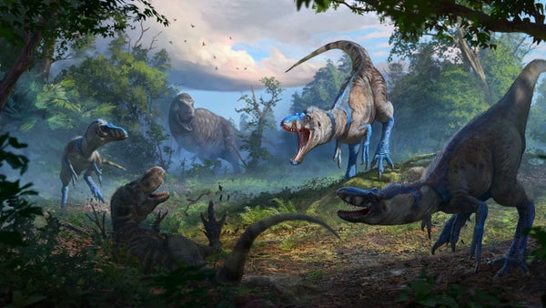 Several dinosaurs pose threateningly while roaring at each other
