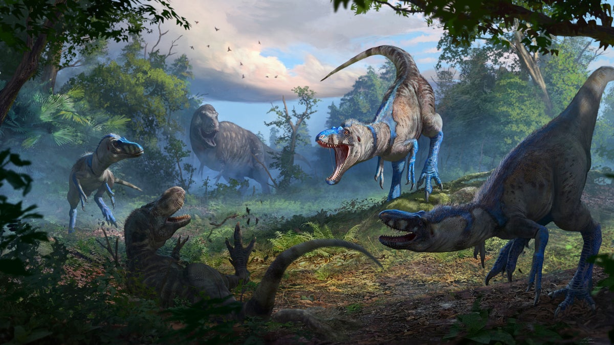 Several dinosaurs pose threateningly while roaring at each other