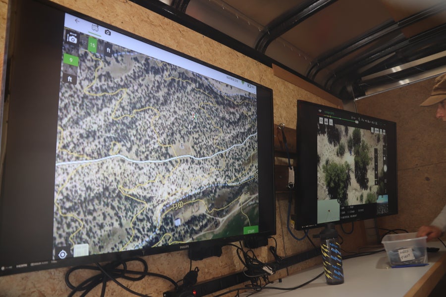 Computer screens inside a drone control center