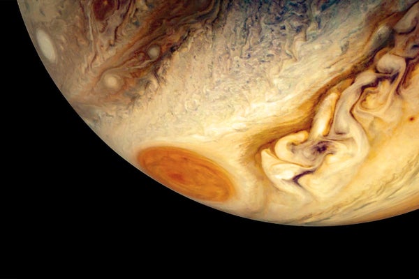 Partial view of Jupiter's southern hemisphere with the Great Red Spot appearing on the far edge of the planet