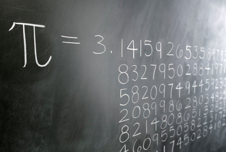 A blackboard shows the digits of pi drawn out in chalk.