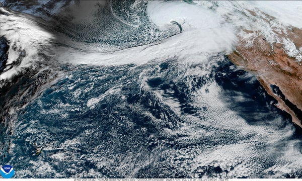 GeoColor daytime image of the United States Pacific coast showing a storm system approaching from the west on November 19, 2024