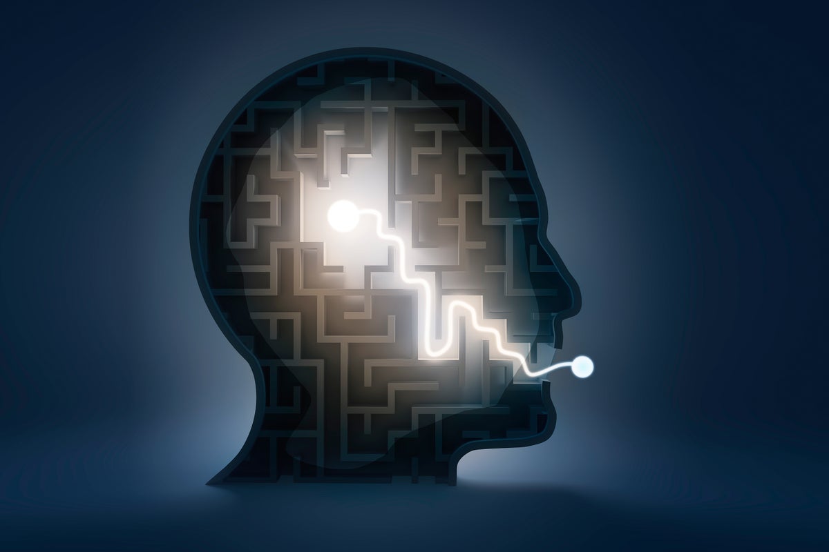 Illustration of a maze in the shape of a human head with a glowing path leading from the center of the head and exiting through the mouth
