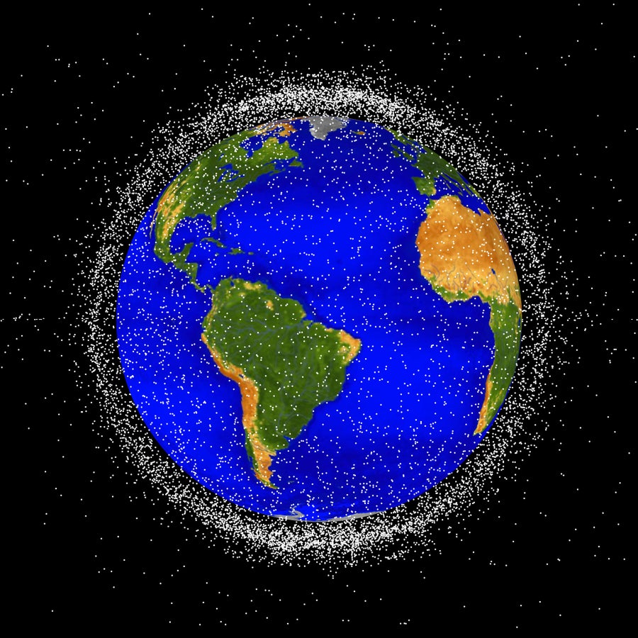 Graphic with computer generated images of objects in Earth orbit that are currently being tracked. Orbital debris is represented with white dots and are scaled according to the image size of the graphic 