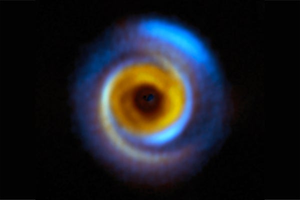 This composite image shows the MWC 758 planet-forming disk, located about 500 light-years away in the Taurus region, as seen with two different facilities.