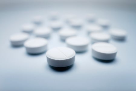 a close up of white circular pills
