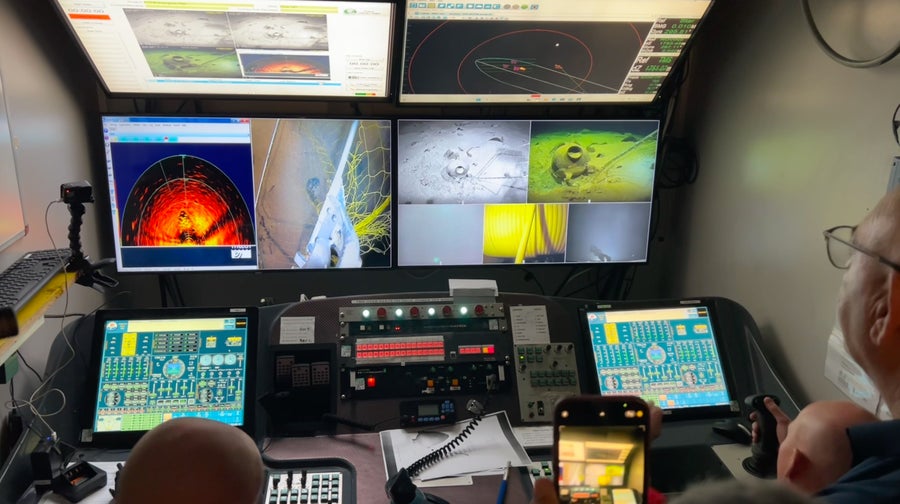 IAA archaeologist Jacob Sharvit watches as ROV operators scoop up 3,300-year-old Canaanite storage jars from the seafloor of the Mediterranean on May 30, 2024.