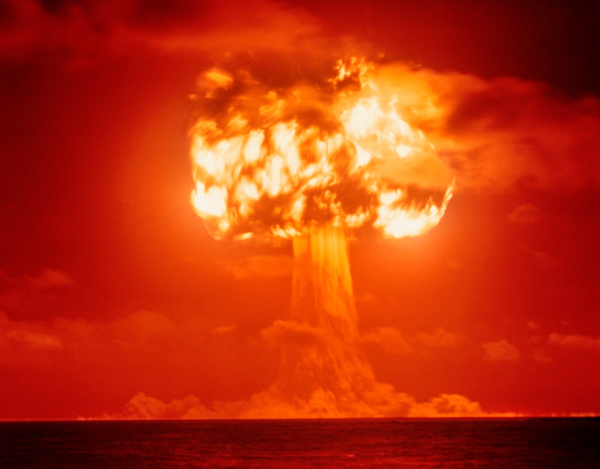 Mushroom cloud with orange sky.