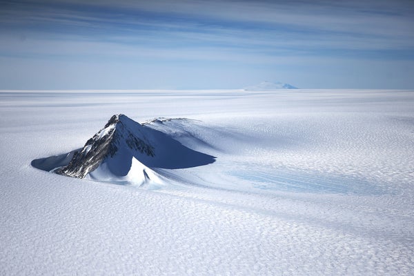 A section of the West Antarctic Ice Sheet with mountains is viewed from a window of a NASA Operation IceBridge airplane on October 28, 2016.