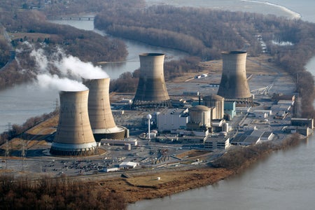 Cooling towers emit steam at Three Mile Island nuclear power plant.