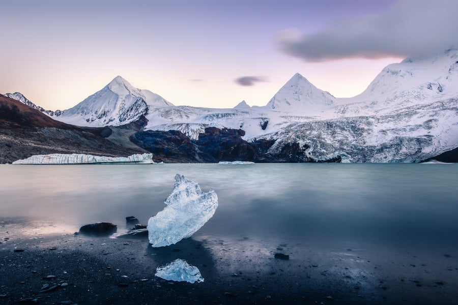 Ice lake and snowcapped mountain in southeast Tibet.